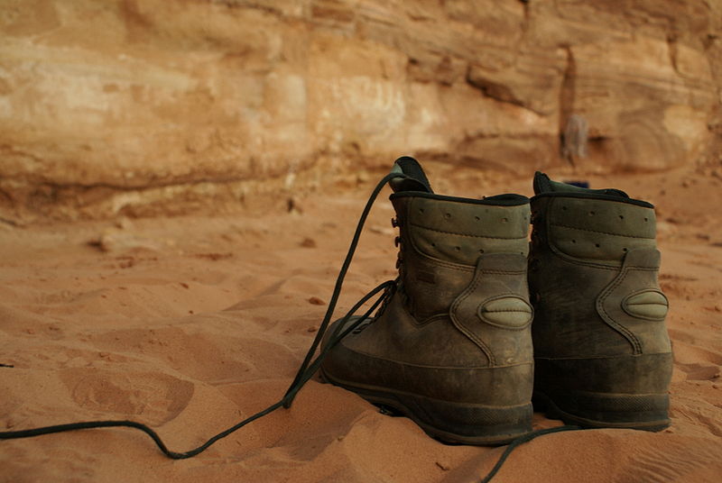 Hiking boots on a mountain trail - Explaining the stockdale paradox and true identity at our father son bonding christian camp