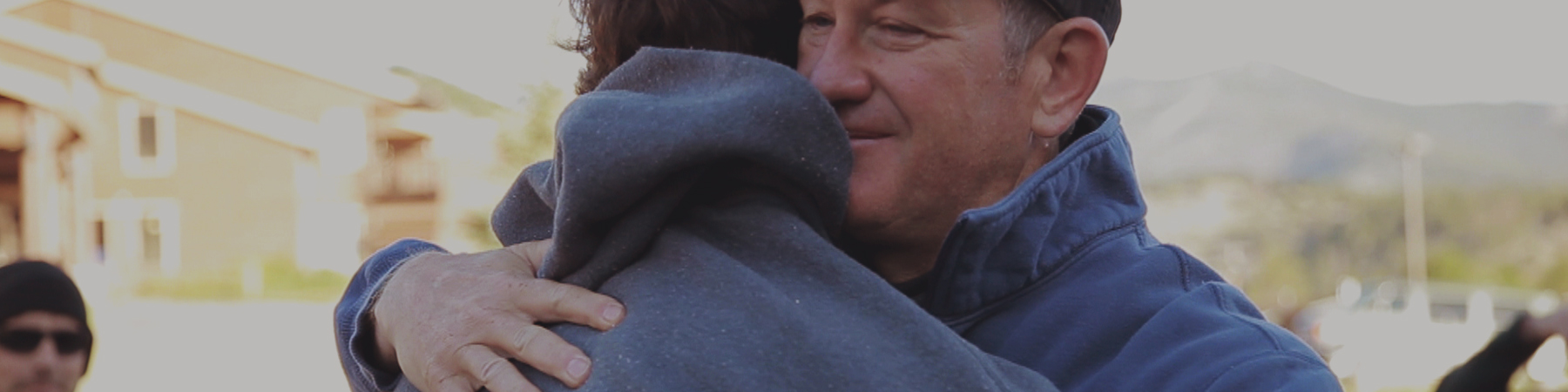 Father And Son Hugging at a Christian camp in Colorado